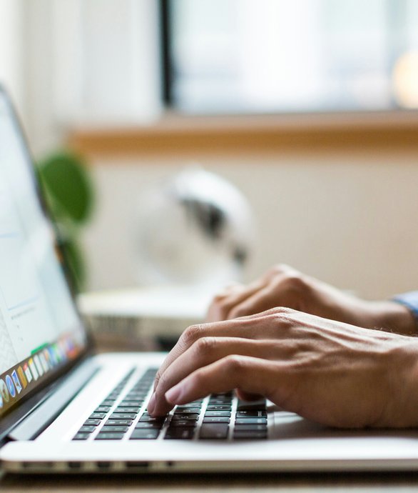 Small business owner using laptop with professional website design